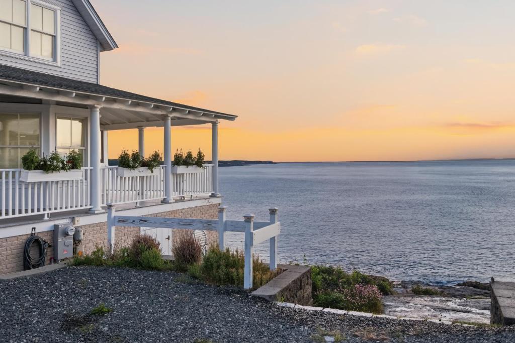 a house with a view of the ocean at Luxury York Oceanfront Nubble Views in York