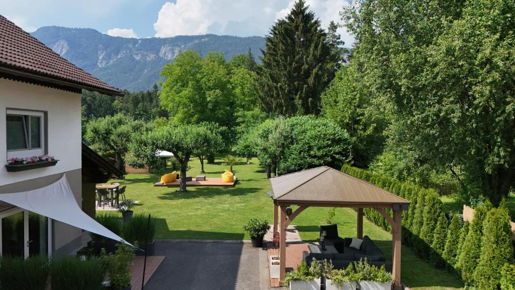 a backyard with a gazebo and a garden at FACT Apartments in Arnoldstein