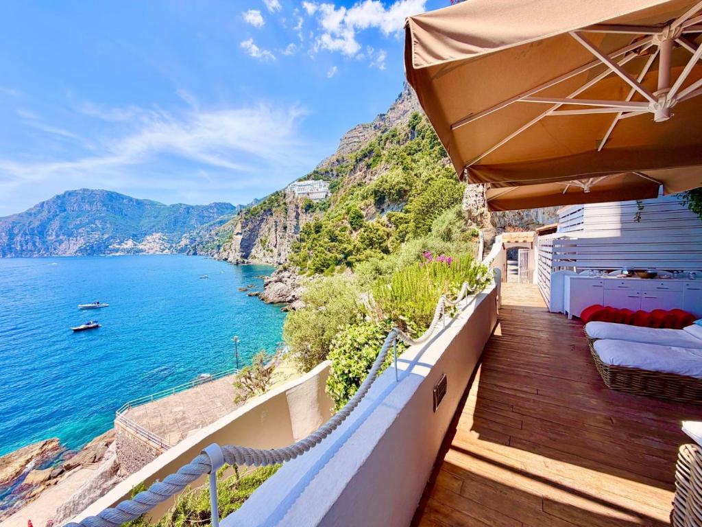 a balcony with a view of the ocean at Suite Sole Praiano in Praiano