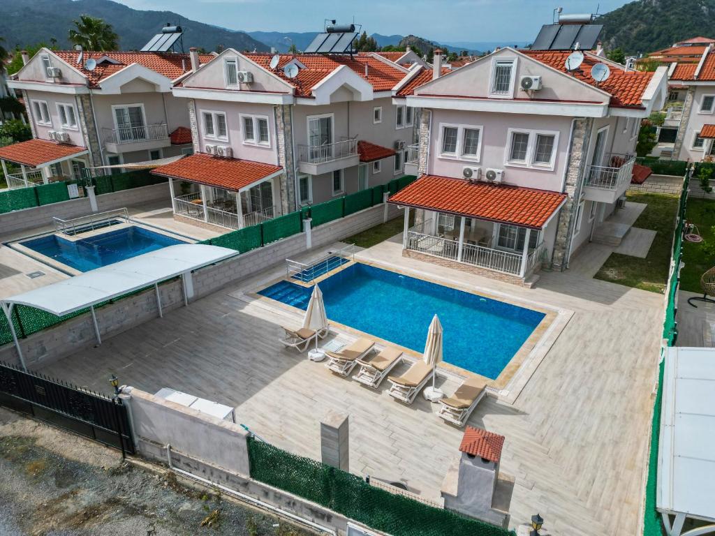 an aerial view of a house with a swimming pool at villa hazar in Ortaca