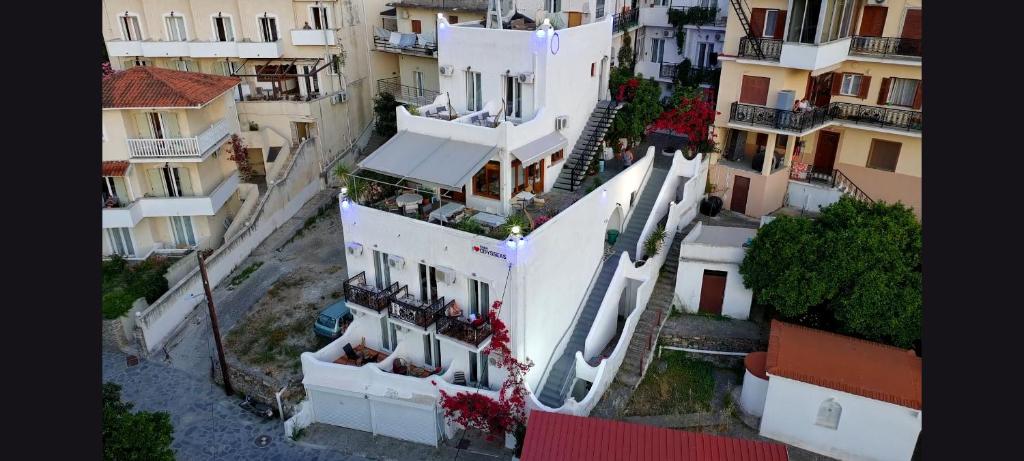 an aerial view of a white building with balconies at ODYSSEAS HOTEL SAMOS in Samos