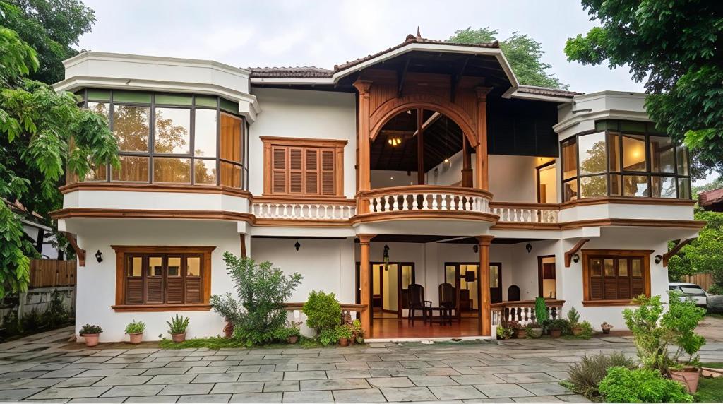 a house with a lot of windows at Samudra heritage in Cochin