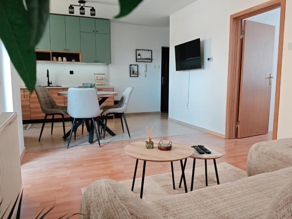 a living room with a couch and a table at Stella Verde in Vršac