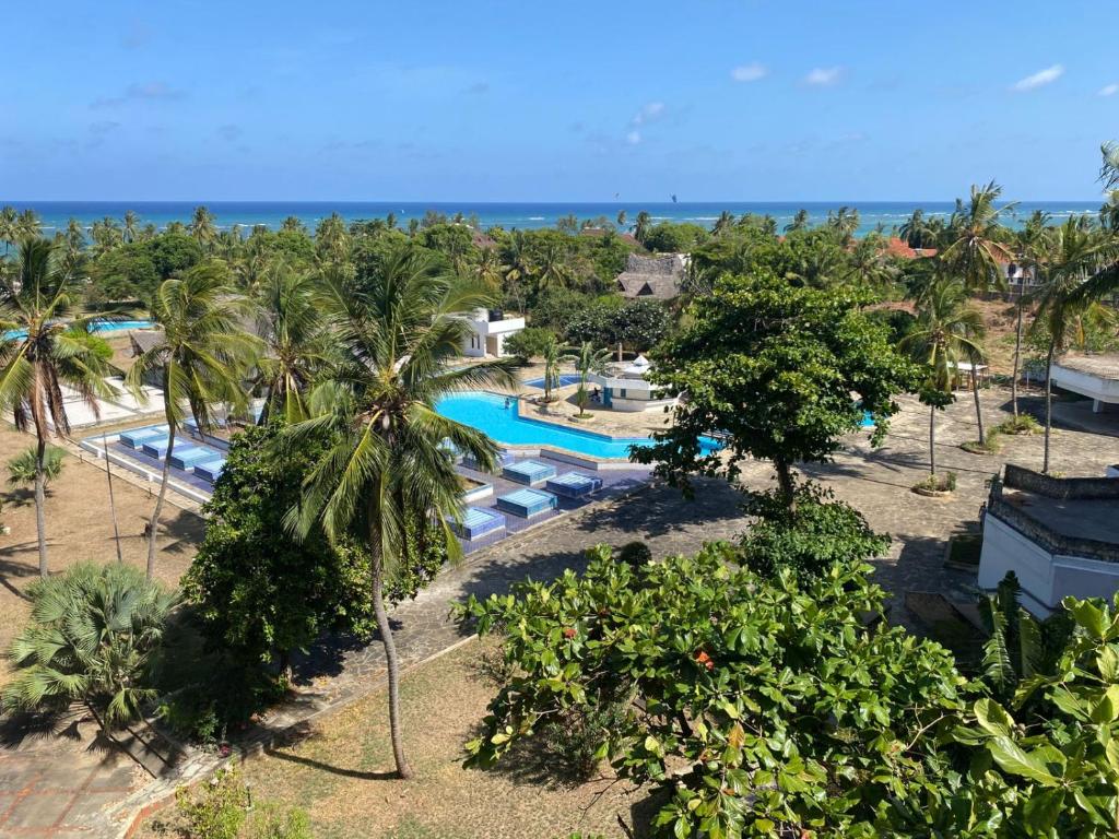 an aerial view of a resort with a swimming pool at Ocean view villa in Diani Beach
