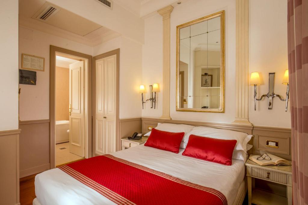 Postel nebo postele na pokoji v ubytování Hotel Villa Glori