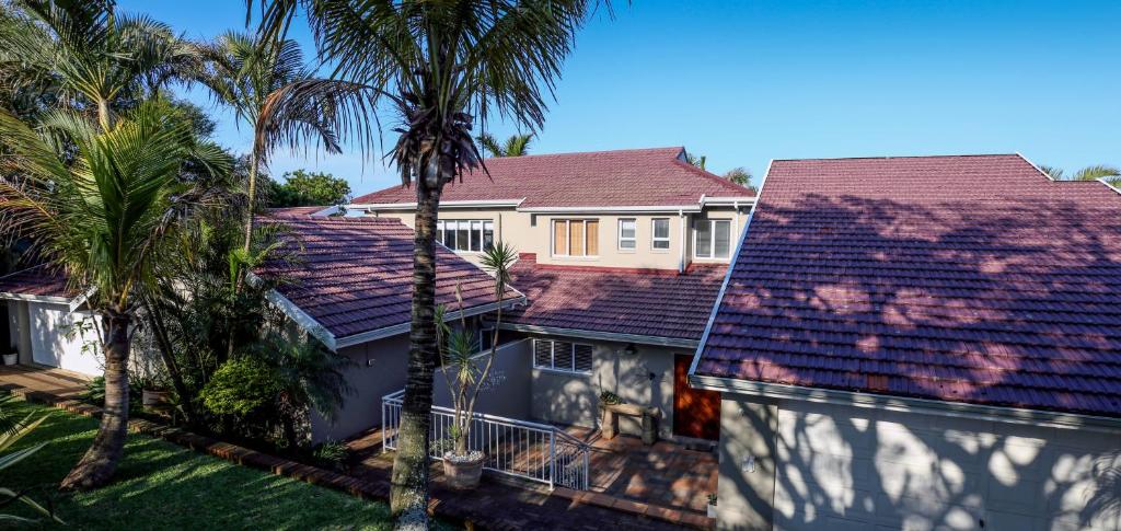 an aerial view of a house with palm trees at Acacia Crescent Seaview Manor in Westbrook
