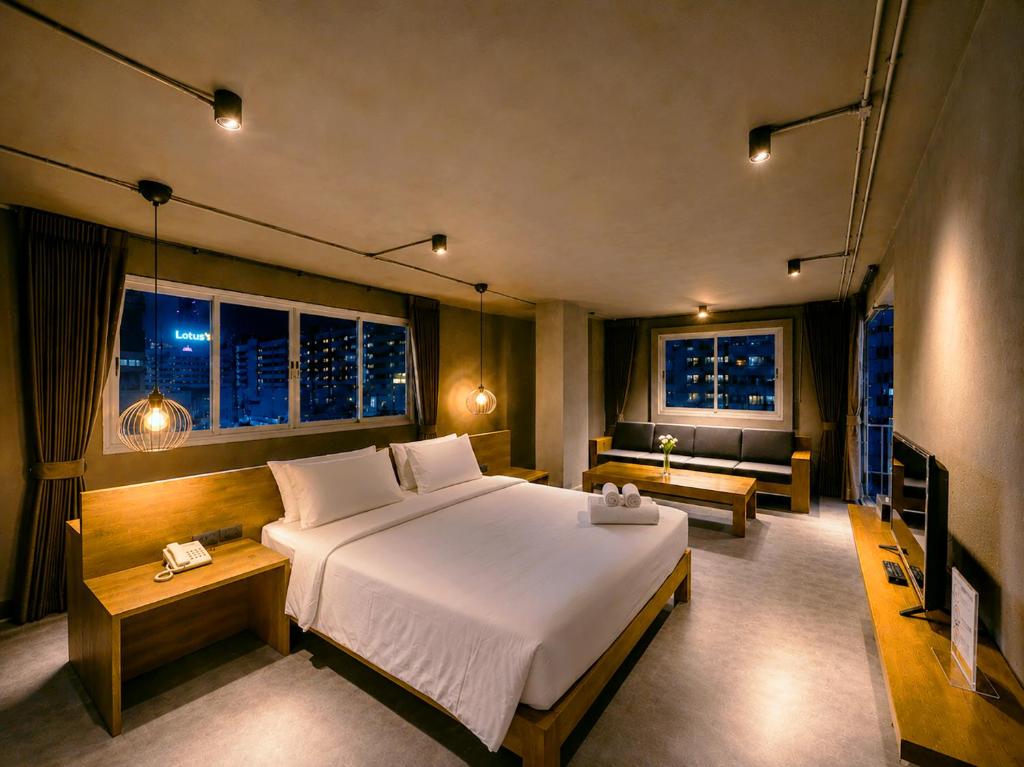 เตียงในห้องที่ โรงแรมเซ็นทริคเพลส