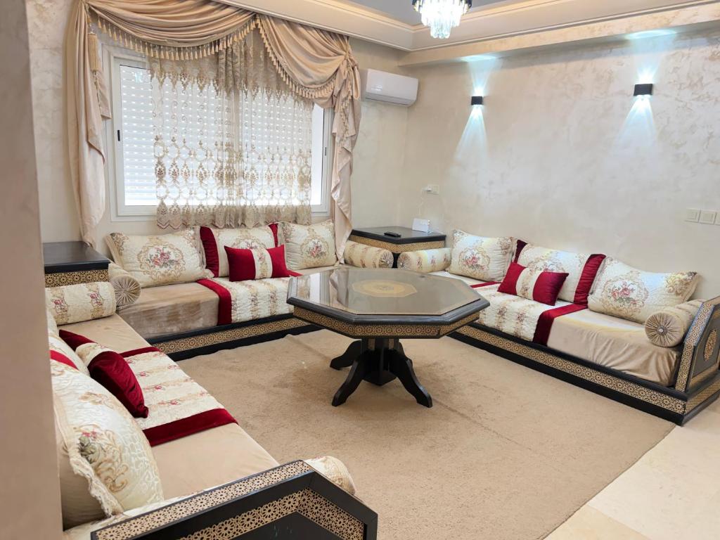 a living room with couches and a table at Assafa in Agadir