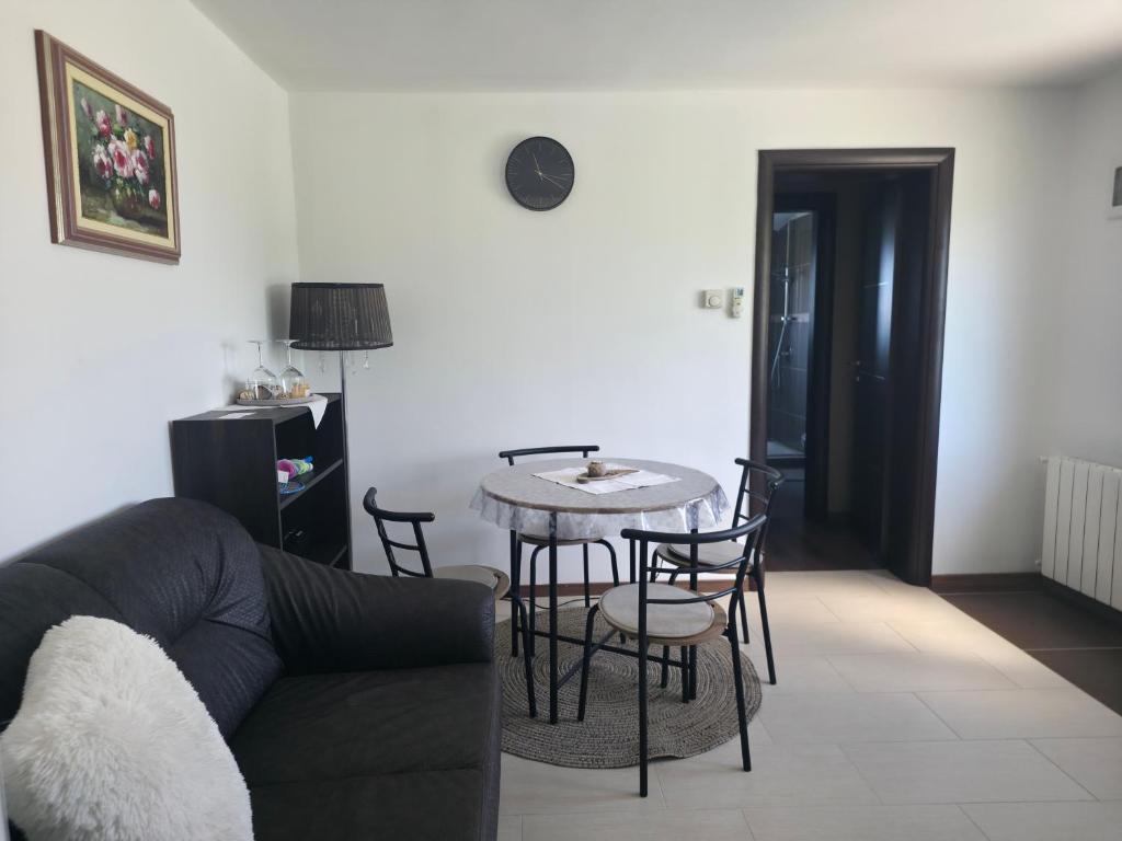 a living room with a couch and a table at Petra in Poreč