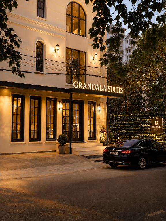 a car parked in front of a building at Grandala Suites - A Boutique Hotel in Cochin