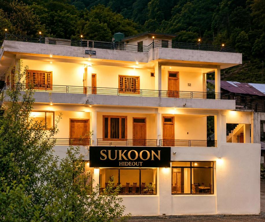a large white building with a sign in front of it at Sukoon Hideout Kaghan Valley in Lahar Bānda
