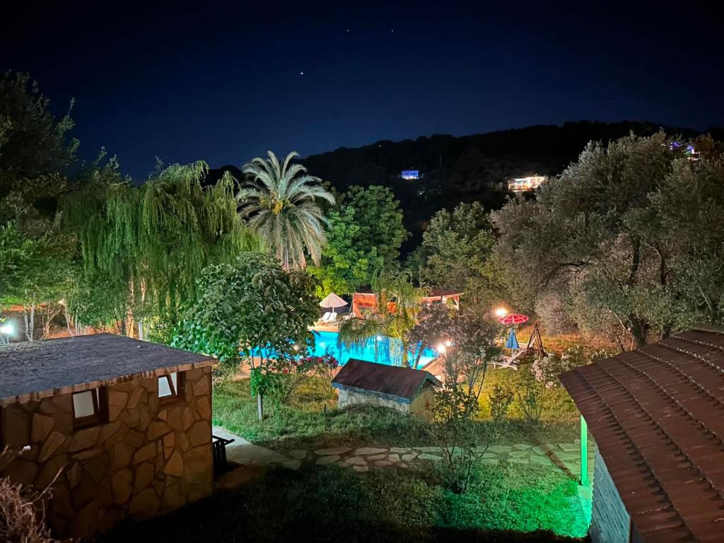 a view of a garden at night with lights at Denge Hidden Garden in İslâmlar