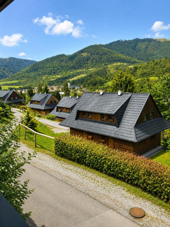 a house with a gray roof on a mountain at Drevenica Jánošík 1 in Terchová
