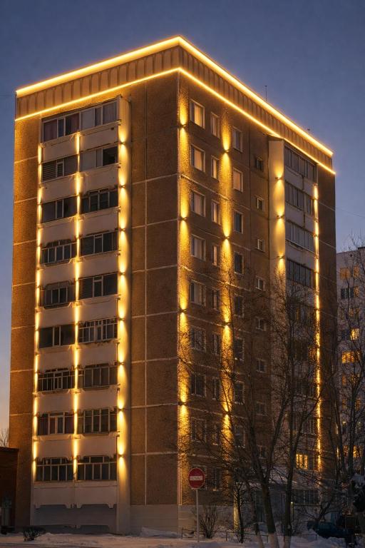 a building with lights on the side of it at Три богатыря in Līsakovsk
