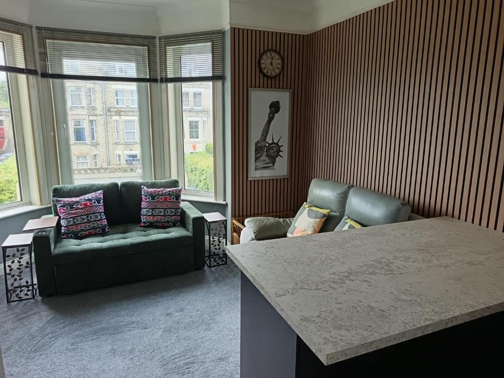 a living room with a couch and a table at Dover White Cliff Apartment in Dover