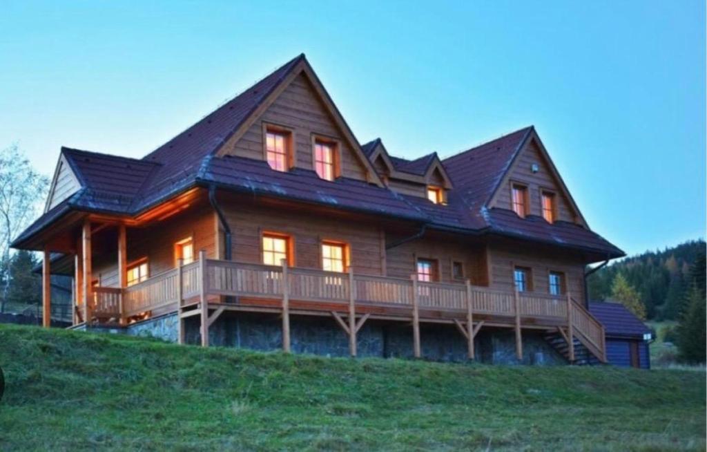 a large wooden house on top of a hill at Chalet Mates in Ždiar