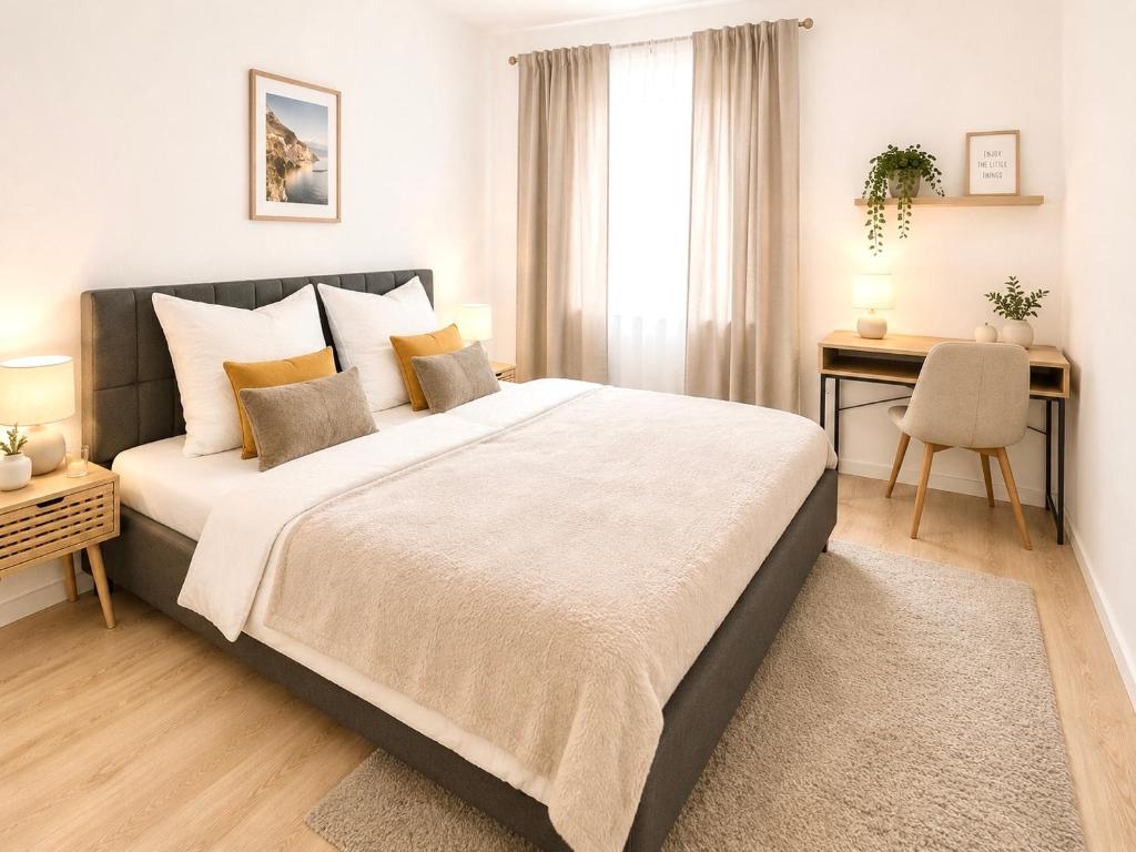 a bedroom with a large bed and a desk at Stadtwohnung in Siegen-Zentrum Parkplatz WLAN Autobahn in Siegen