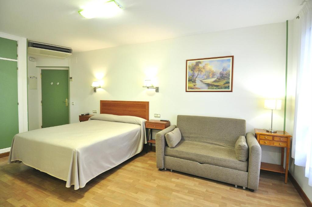 Posteľ alebo postele v izbe v ubytovaní Hotel Apartamentos Aralso