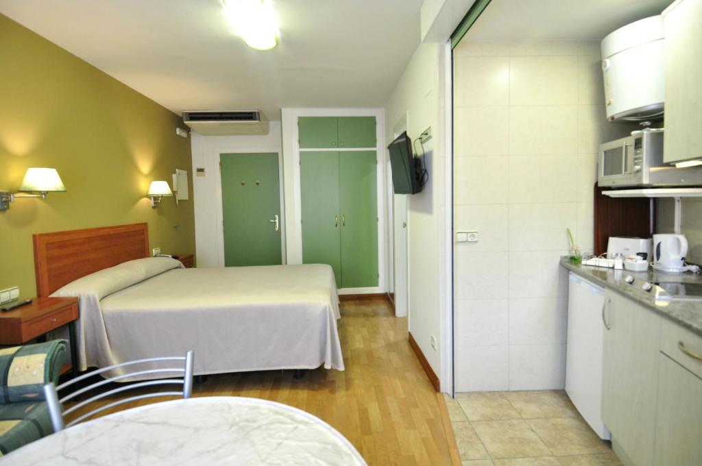 Posteľ alebo postele v izbe v ubytovaní Hotel Apartamentos Aralso
