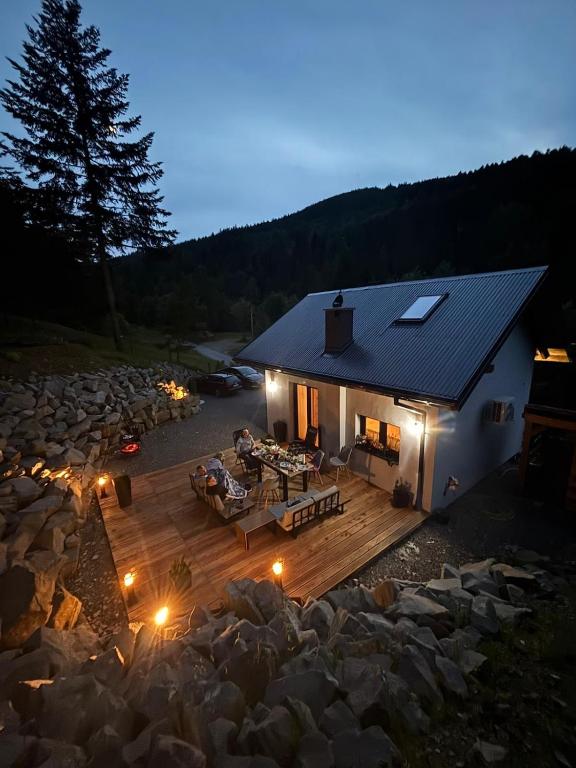 an aerial view of a house with a deck with a fire pit at Domek pod Głazami in Ostre