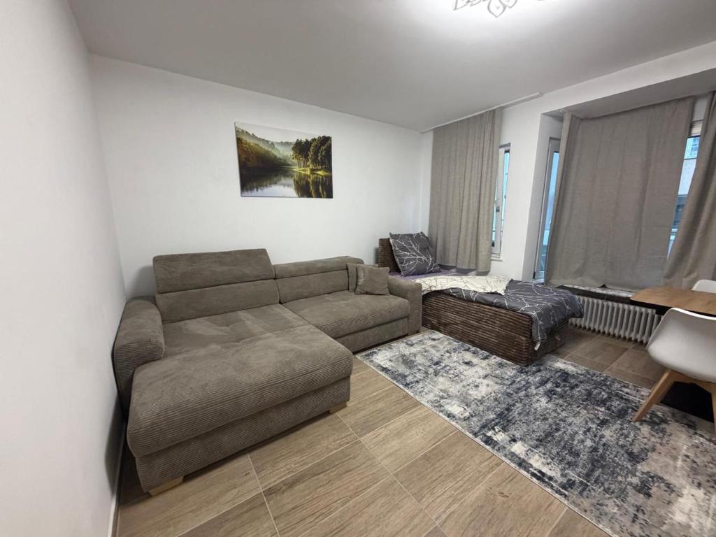 a living room with a couch and a table at Downtown in Bonn