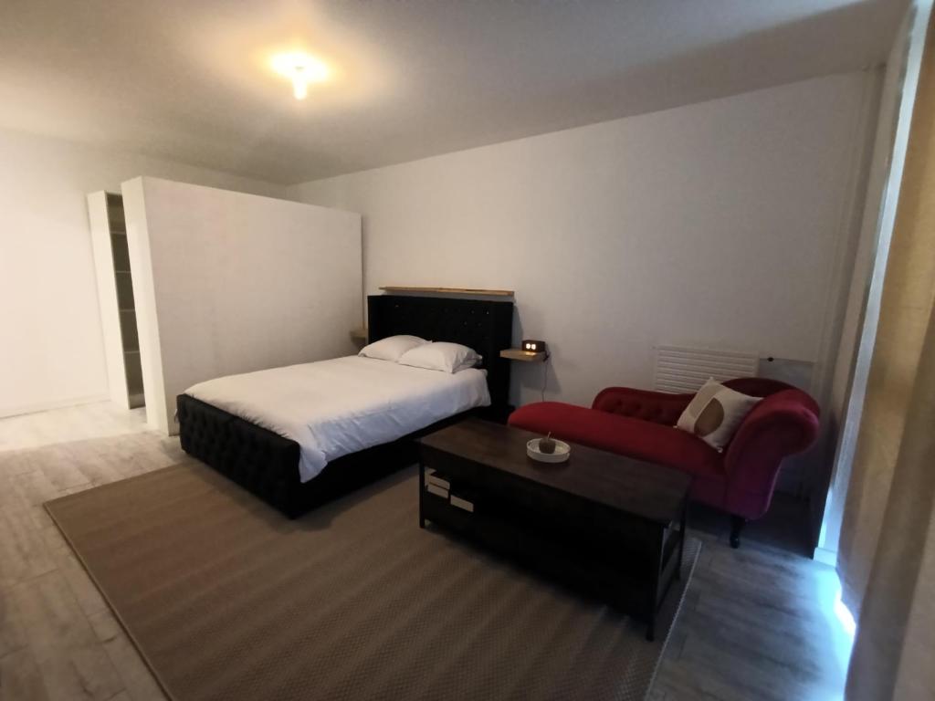 a hotel room with a bed and a couch at Vannes in Brest