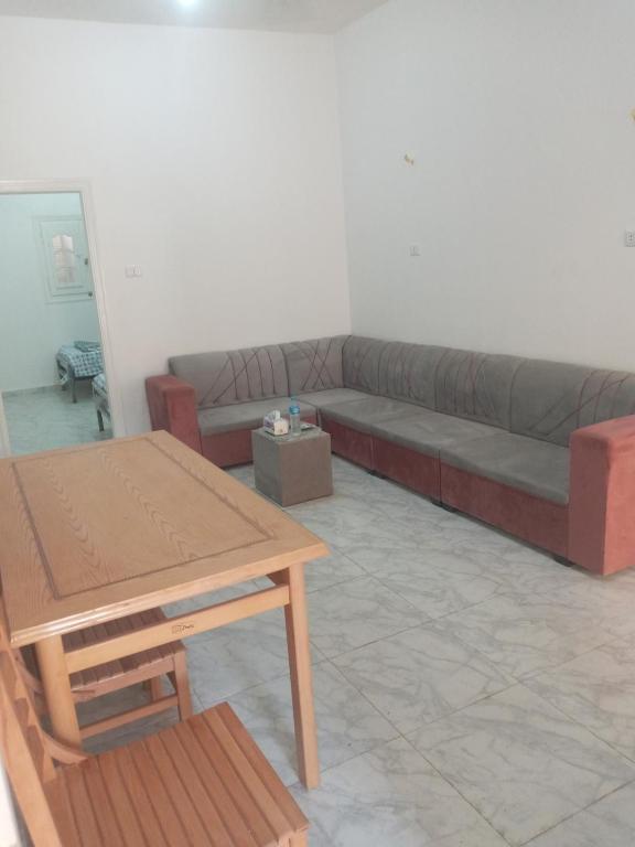 a living room with a couch and a table at HASH # SAAd in Marsa Matruh