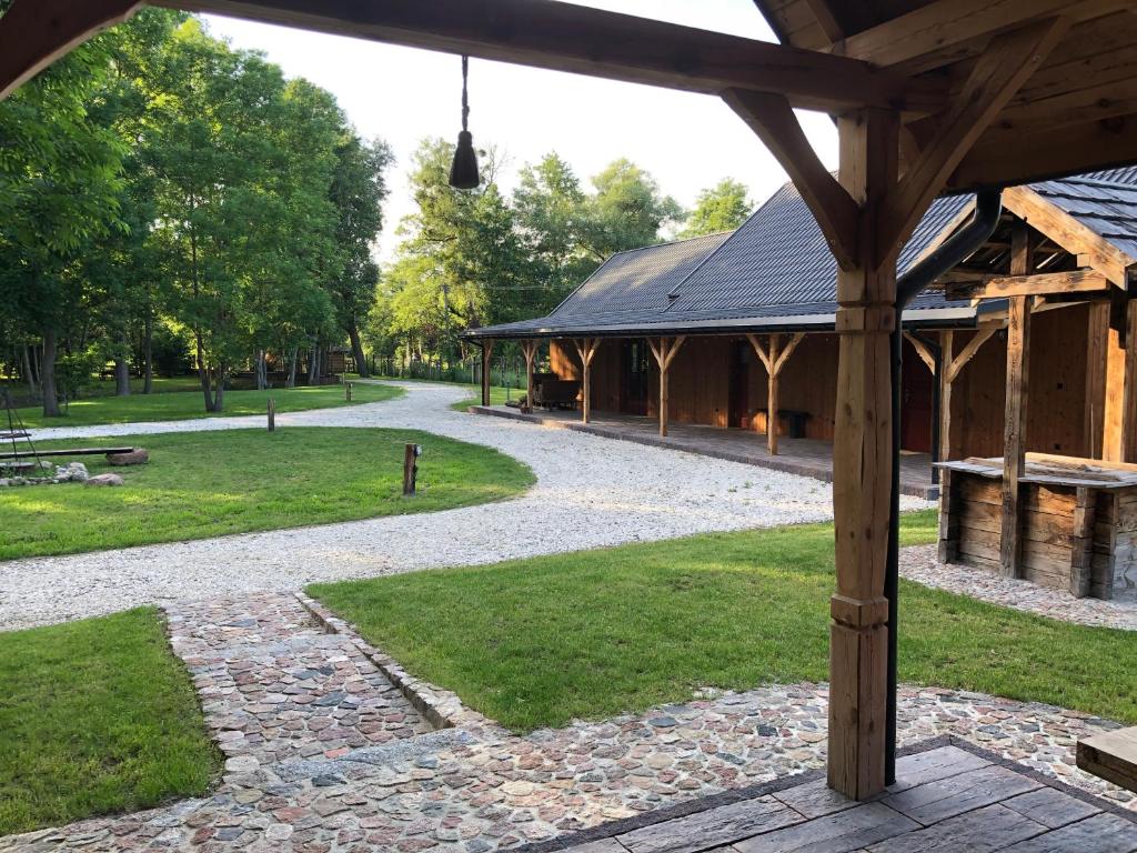 a pavilion in a park with a walkway at ALVORADA Mościce Dolne nad Bugiem in Nowosiółki