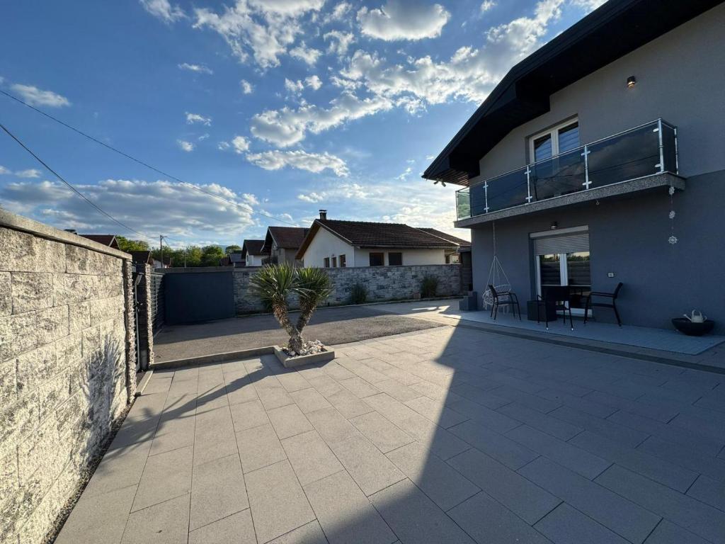 a patio of a house with a fence at Una Bihac 4 in Bihać