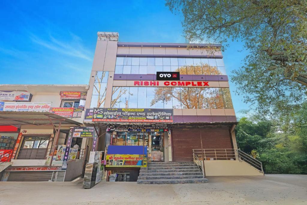 a building with a train cruelty sign on it at Hotel O City View in Alīgarh