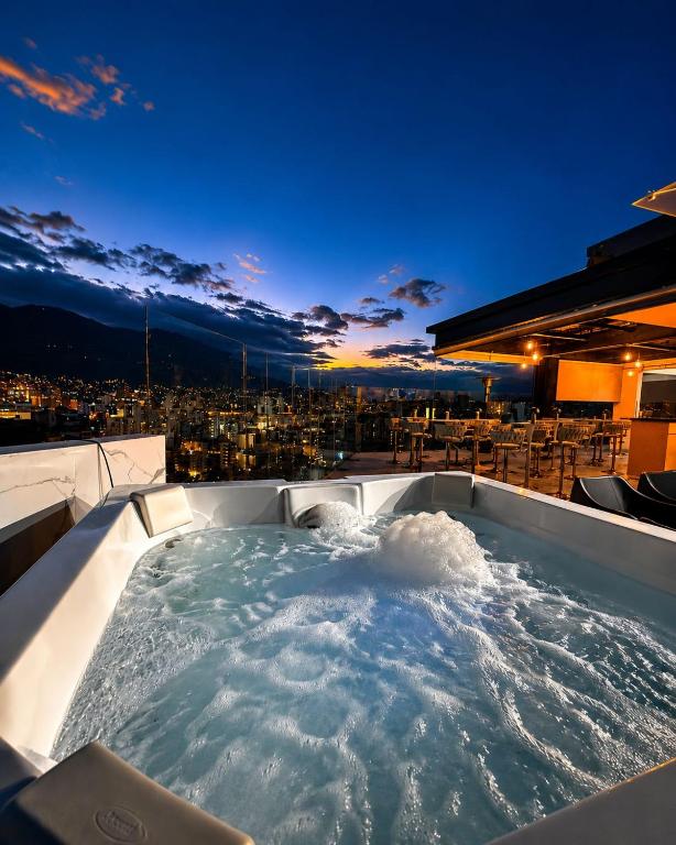 a jacuzzi tub on the roof of a building at NIDO Boutique Hotel in Quito