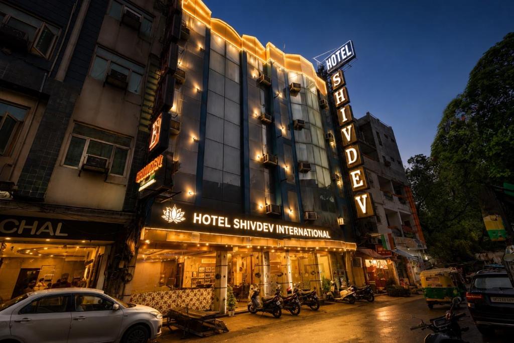 a hotel on a city street at night at Hotel Shivdev International, near New Delhi Railway Station & City Centre in New Delhi