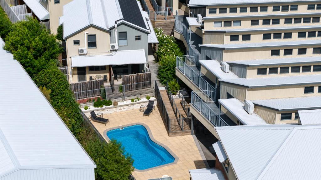 an aerial view of a building with a swimming pool at Sovereign Views Apartments in Ballarat