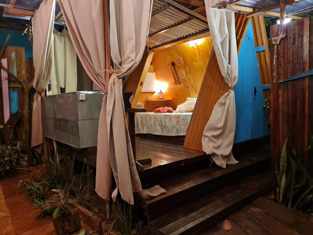 a room with a bed in a tent at Mucajá Glamping com charme a poucos passos da Ilha in Alter do Chao