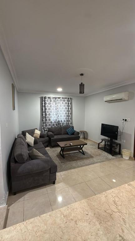 a living room with a couch and a table at الدانه1 in Al Wajh