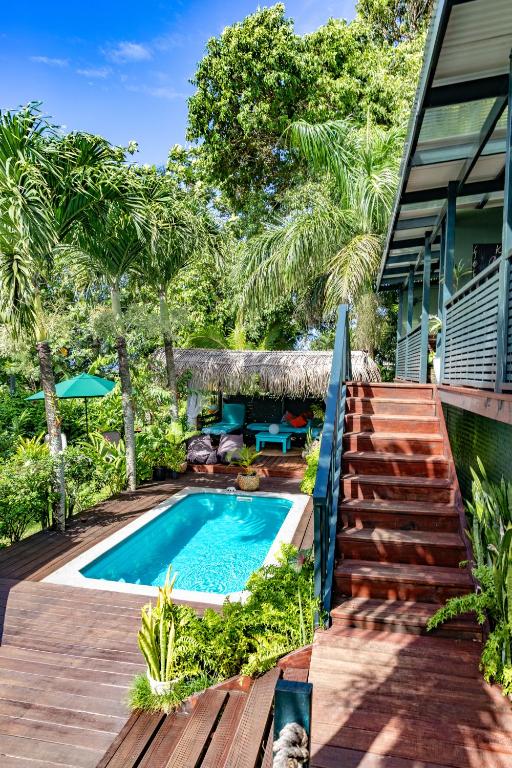 a swimming pool in the backyard of a house at Ariki Retreat - Adults Only in Rarotonga