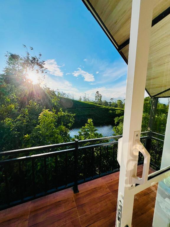 a balcony with a view of a river at Moon Mist Villa- Hatton in Hatton