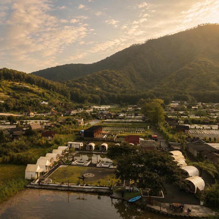 an aerial view of a town with a mountain at Glamour camping bedugul in Bedugul