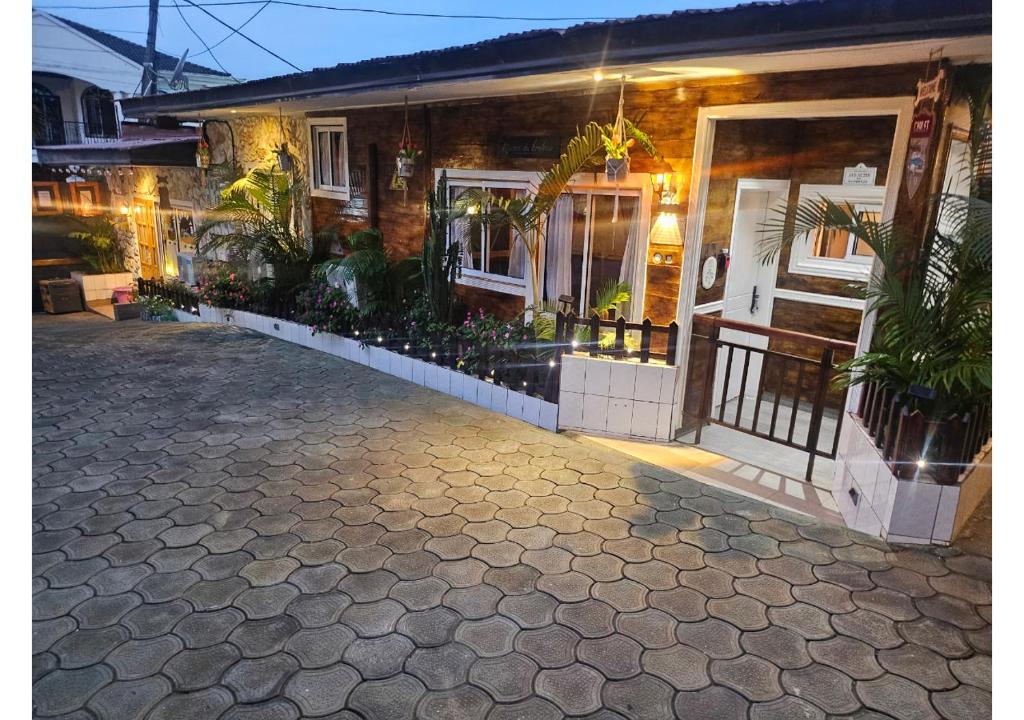 a house with plants in front of it at Retreat Cameroon BASTOS in Yaoundé