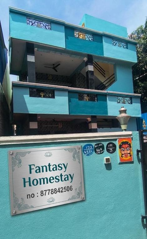 a sign on the side of a building at Fantasy Homestay in Thiruchendur
