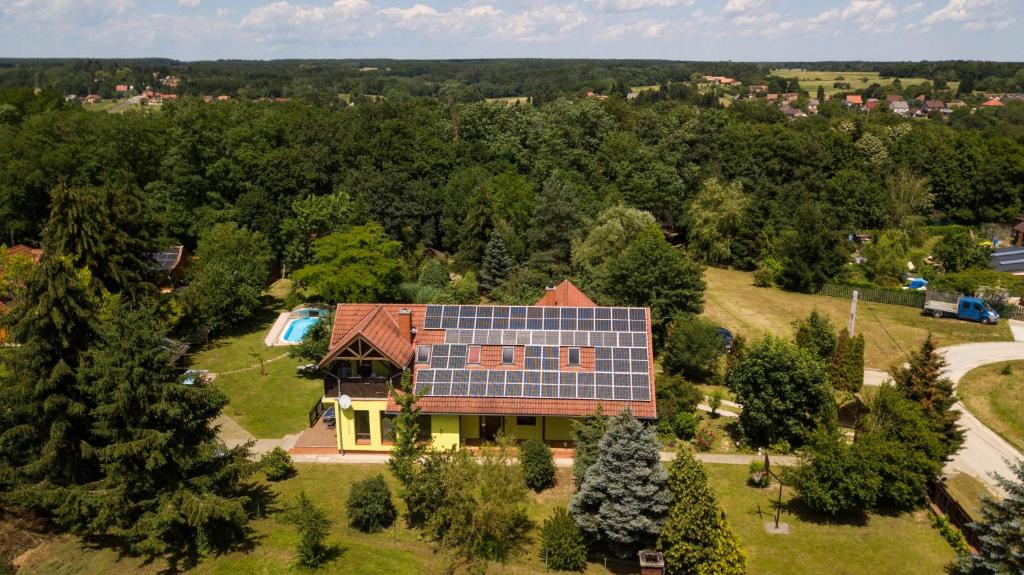 an overhead view of a house with solar panels on the roof at Mihály Kulcsos Vendeghaz in Őriszentpéter