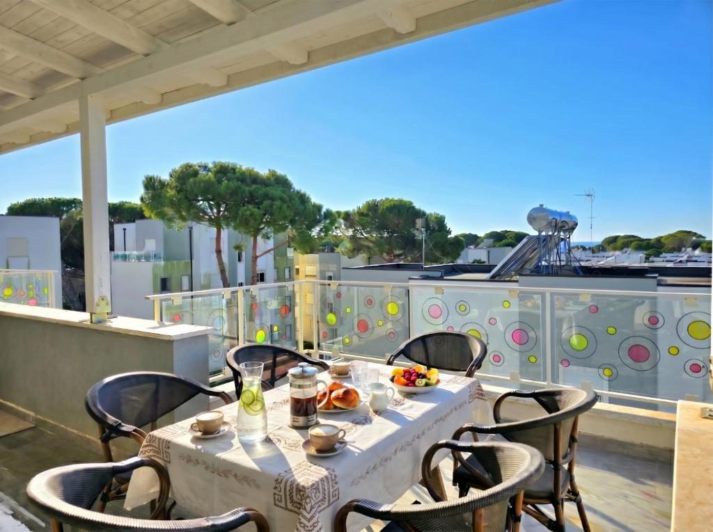 a table on the roof of a building at Sunny Beach Penthouse 271 in Lalzit Bay