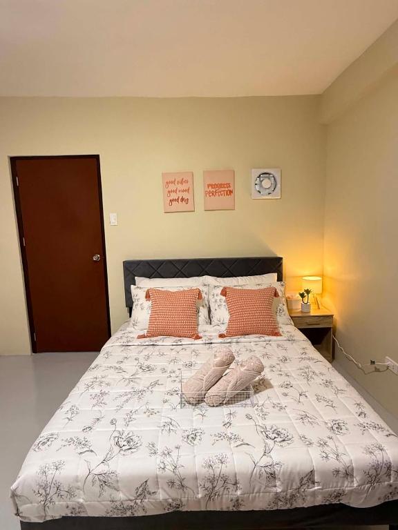 a bedroom with a large bed with two pillows at Thousand Journey 2 in Naga