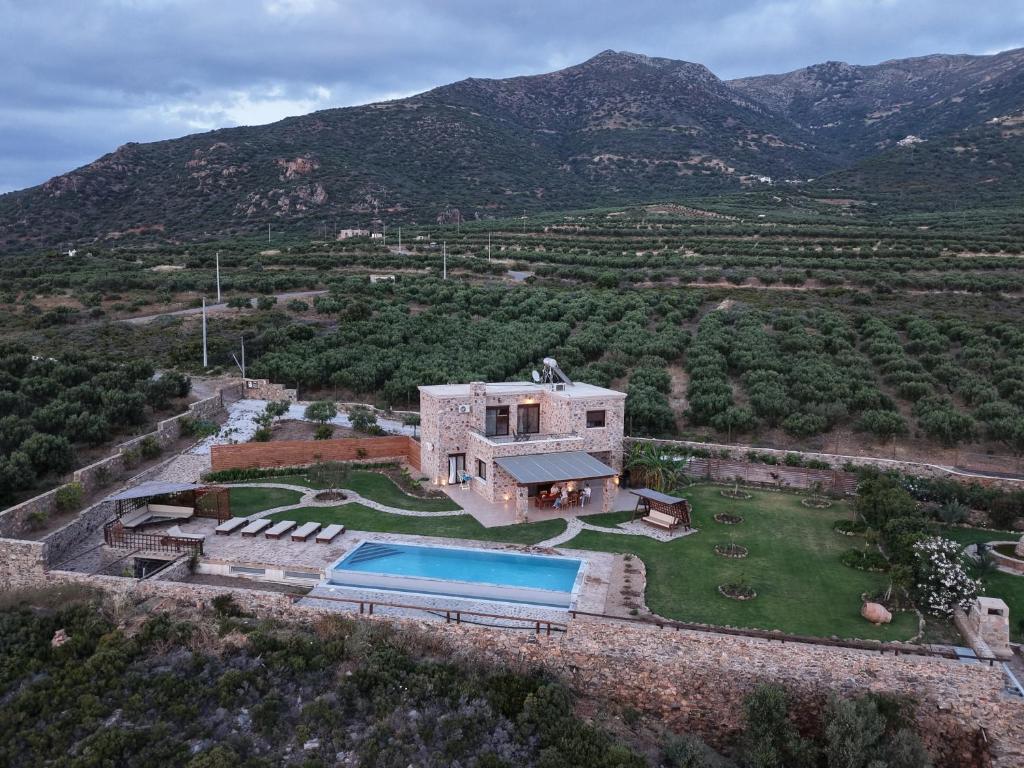 an aerial view of a house with a swimming pool at VILLA DEMETRA in Kissamos