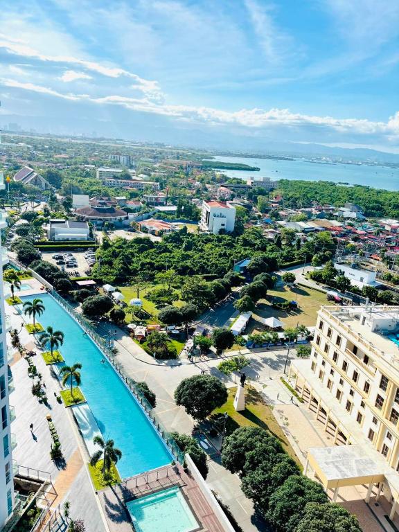 an aerial view of a resort with a swimming pool at Mactan Newtown Condo Rentals in Punta Engaño