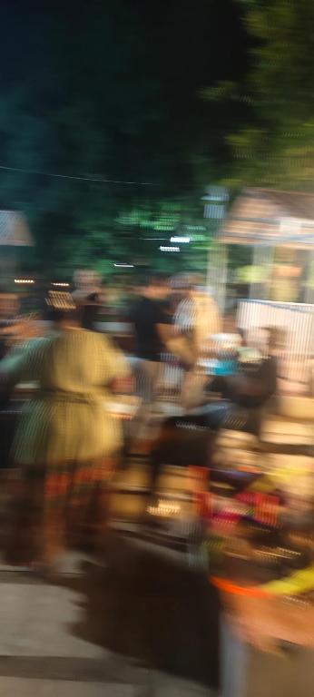 a blurry picture of people on a street at Harshangi Resort wada in Wada