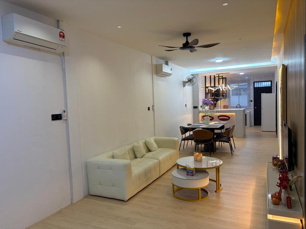 a living room with a couch and a table at Permai Lake Residence in Sibu