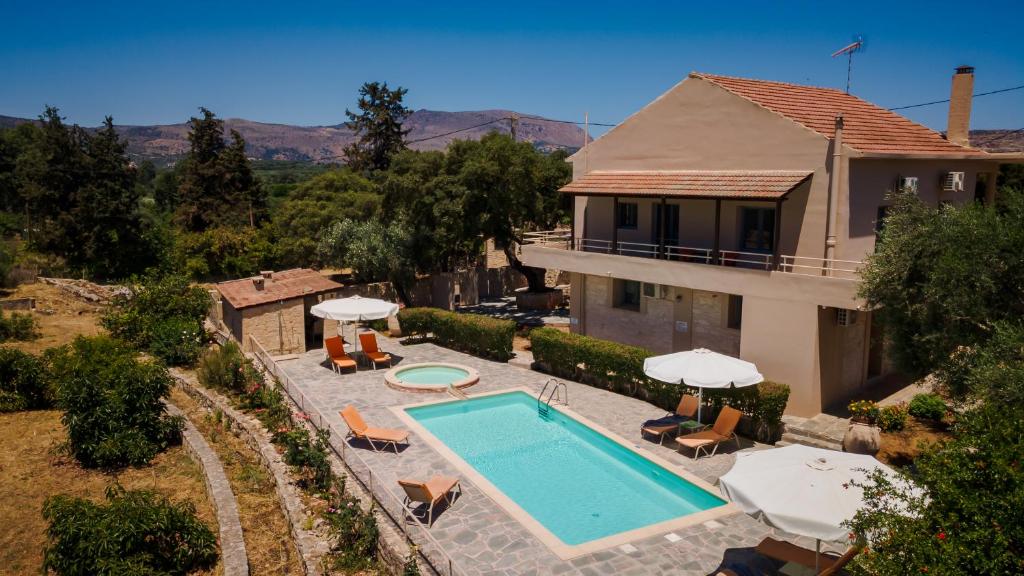 an aerial view of a house with a swimming pool at Villa Maragoudi in Arménoi