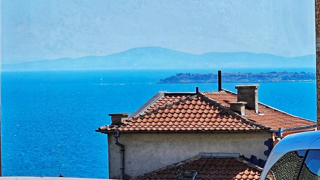 a building with a view of the ocean at Harmony in Sveti Vlas