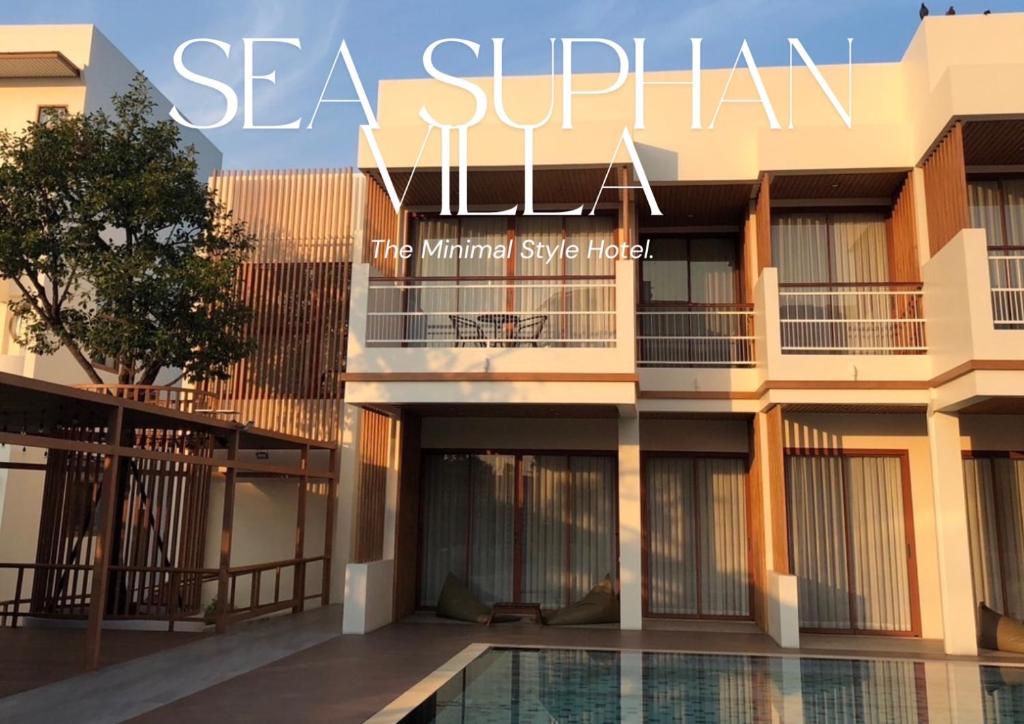 a view of the exterior of a building with a swimming pool at Sea Suphan Villa in Ban Hua Phrong